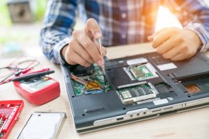 a computer technician repairing a computer