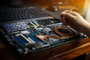 technician working on laptop